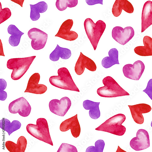 Seamless pattern of decorative colored hearts in chaotic order. Simple drawing. Watercolor hand painted elements isolated on white background.