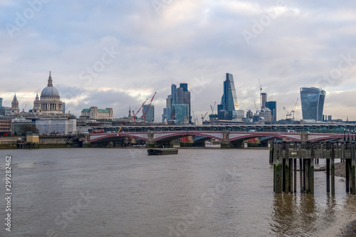 Cityscape of London from Queen's Walk on the south bank of the River Thames