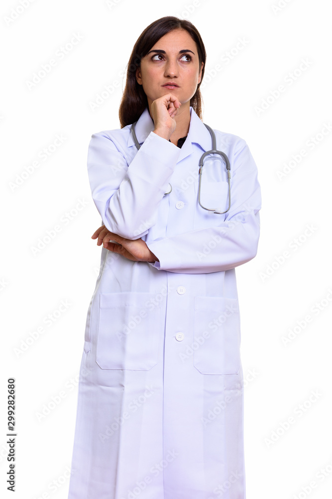 Studio shot of beautiful woman doctor thinking Studio shot of beautiful woman doctor thinking
