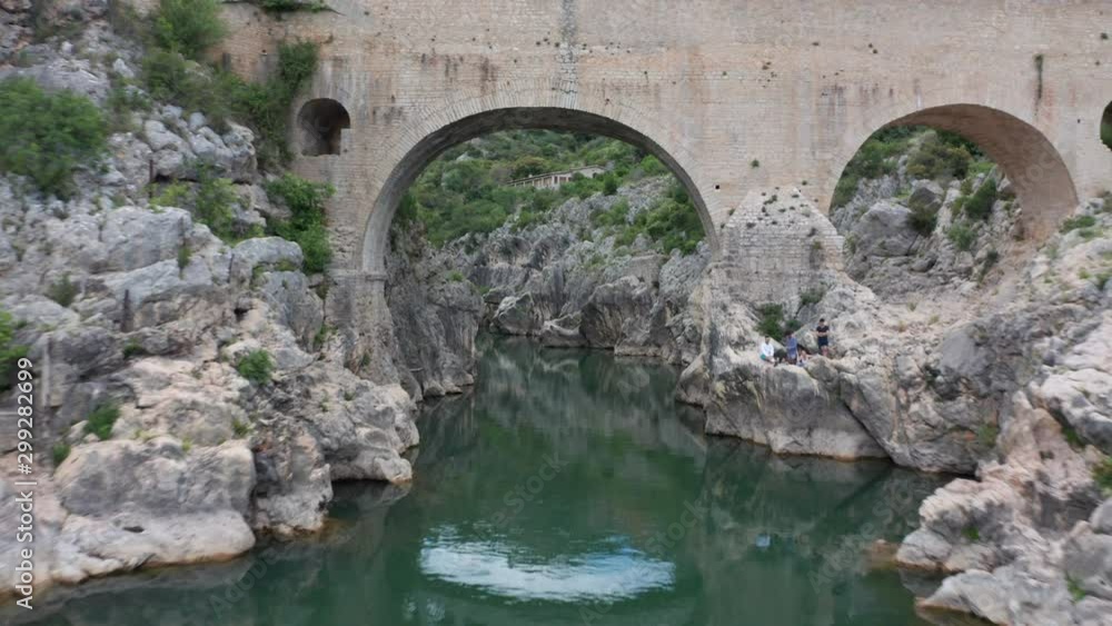 Drone flying over creek with beautiful old bridges Drone flying over creek with beautiful old bridges