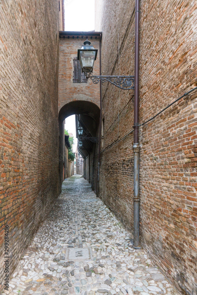 Small alley with lantern in Forli, Italy