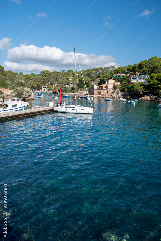 Cala Figuera Majorca, view of this natural port and traditional village which retains an atmosphere of a working fishing port. Clear water on a warm and sunny day.