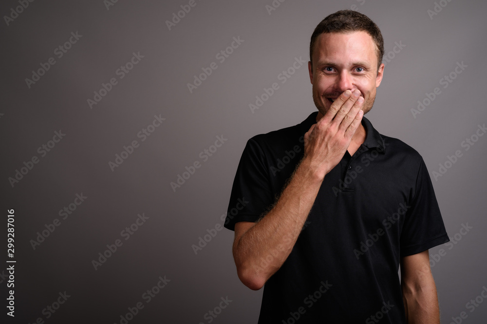 Portrait of handsome man against gray background Portrait of handsome man against gray background
