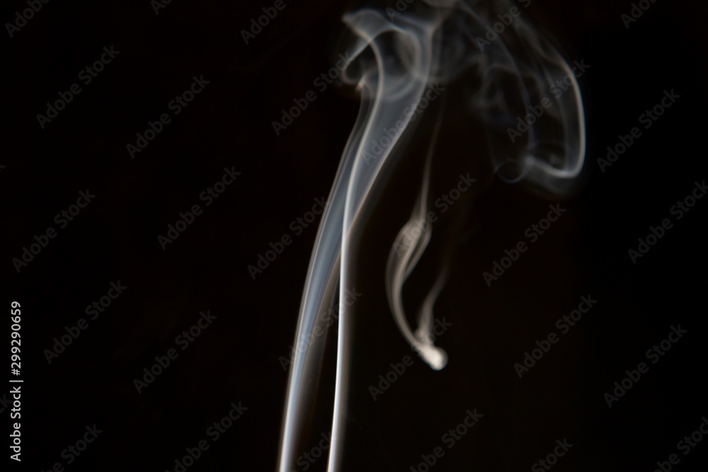 Smoke coming up from an incense stick Smoke coming up from an incense stick