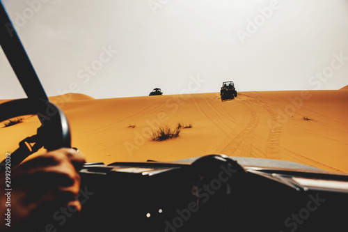 Off road buggies crossing dunes in the desert. Rally raid adventure. © daviles