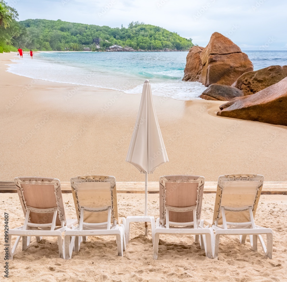 chairs and umbrella on the beach, Seychelles Islands 