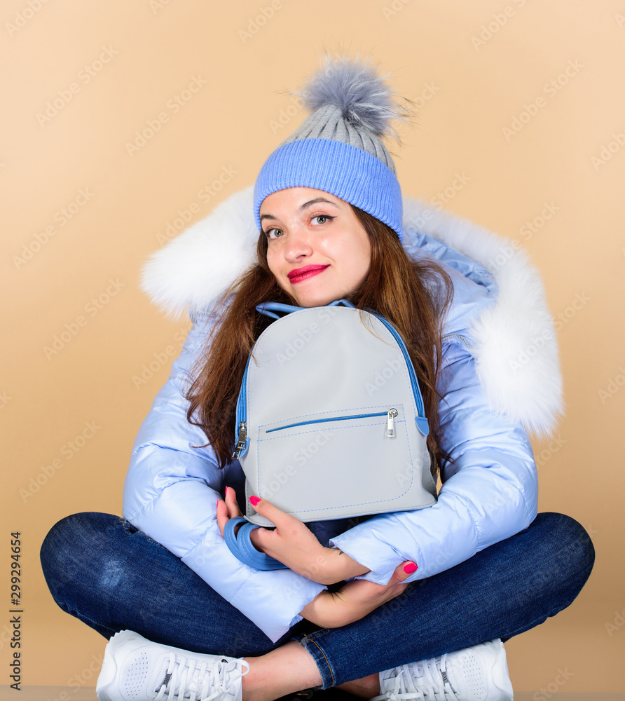 Feeling casual comfortable. Youth style. Casual outfit for modern life.  Casual style. Fashion accessory. Girl adorable model with fancy backpack.  Little backpack and knitted hat. Blue pastel outfit Stock Photo | Adobe