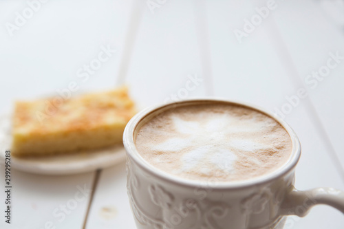 Apple pie with cup of coffee on table