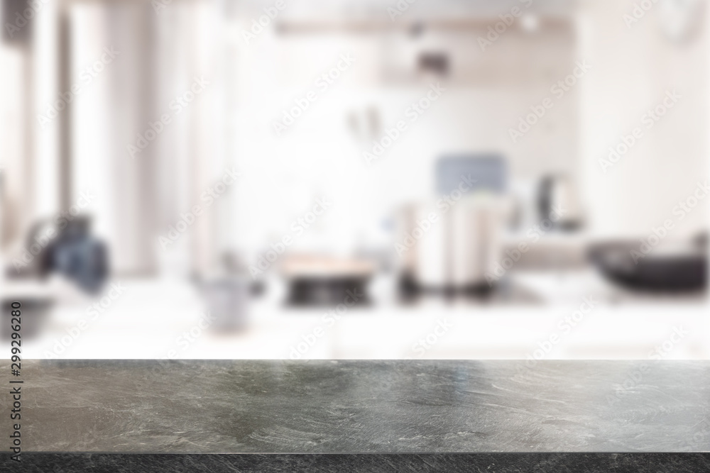 Black Marble Stone table top and blurred kitchen interior background with white light filter - can be used for display or montage your products.