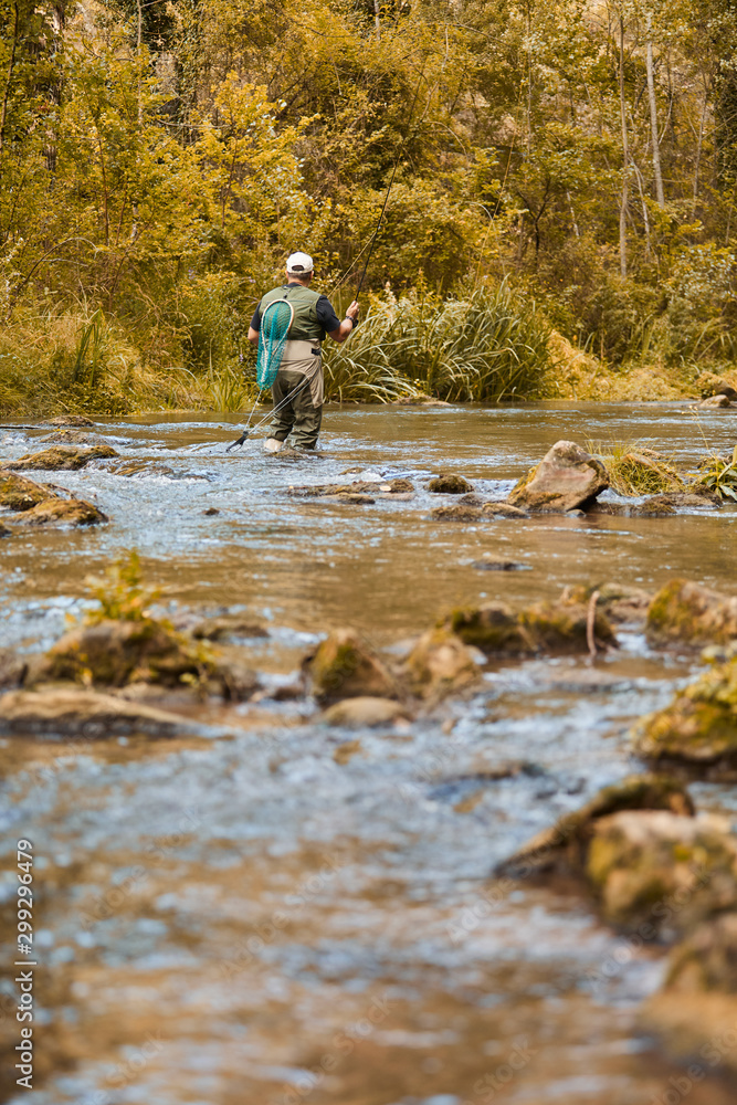 Man fishing a river