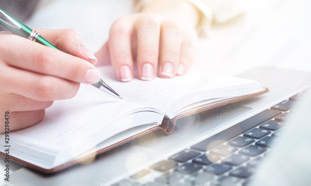 Woman with Laptop and Paperwork on background Woman with Laptop and Paperwork on background