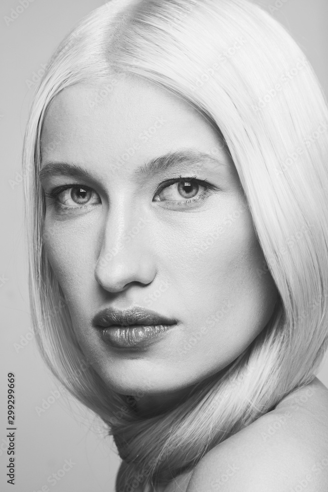 Close-up black and white portrait of young beautiful blonde woman with clean makeup Close-up black and white portrait of young beautiful blonde woman with clean makeup