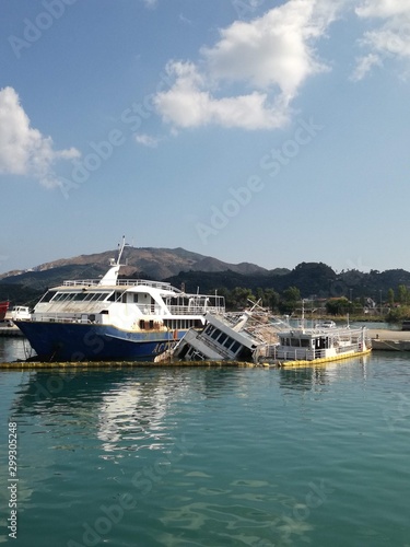 sunken boats in harbor greece