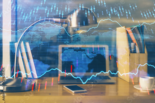 Financial graph colorful drawing and table with computer on background. Multi exposure. Concept of international markets. © peshkova