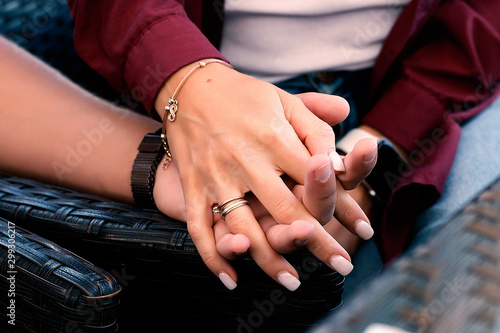 guy holds girl's hand, closeup