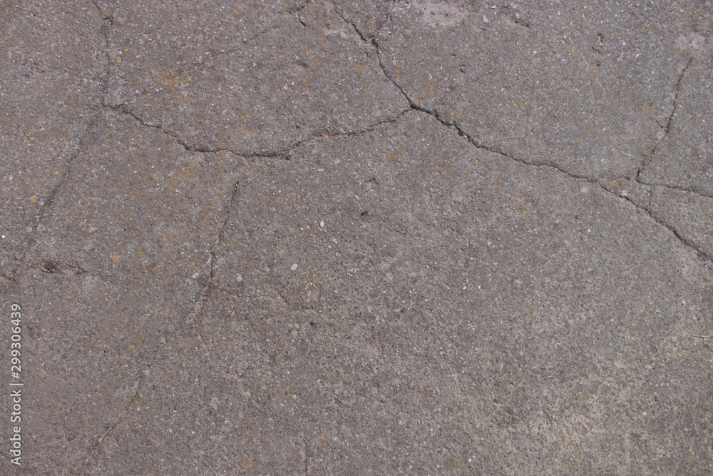 Fototapeta premium old asphalt on the road close-up