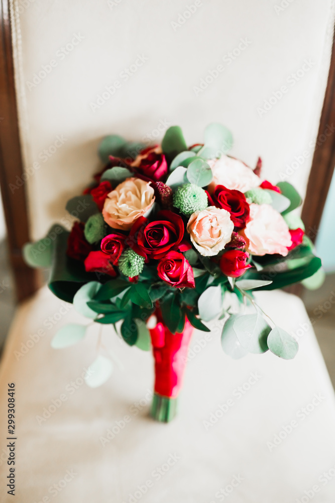 Obraz premium Beautiful wedding bouquet with different flowers, roses