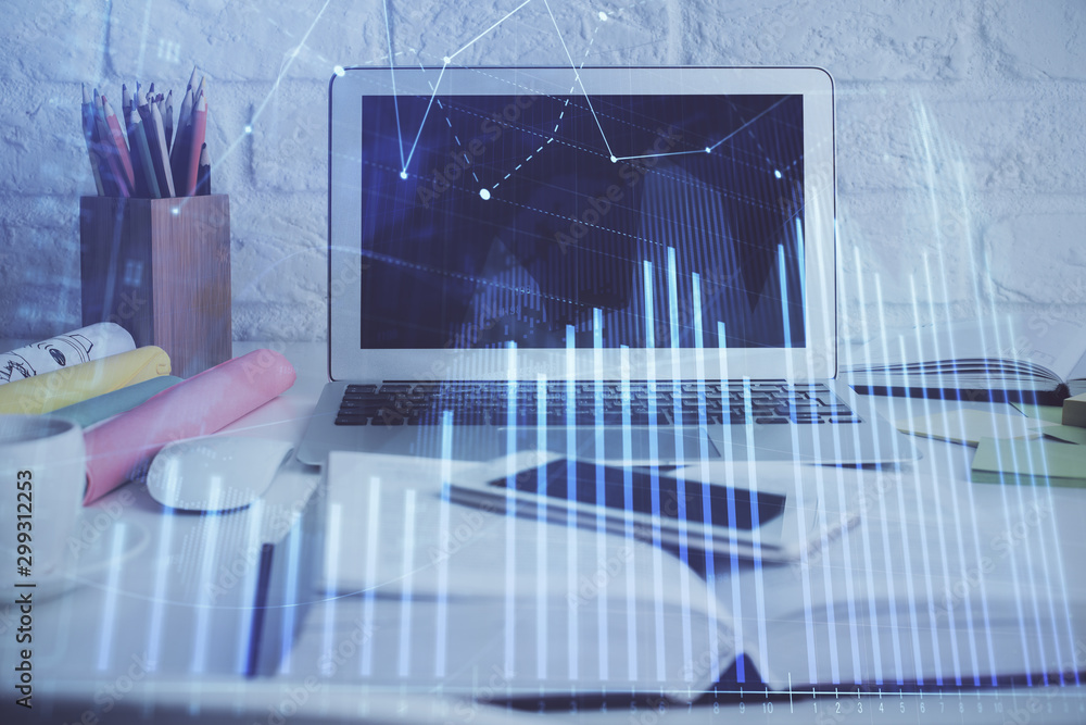 Stock market graph and table with computer background. Double exposure. Concept of financial analysis. Stock market graph and table with computer background. Double exposure. Concept of financial analysis.