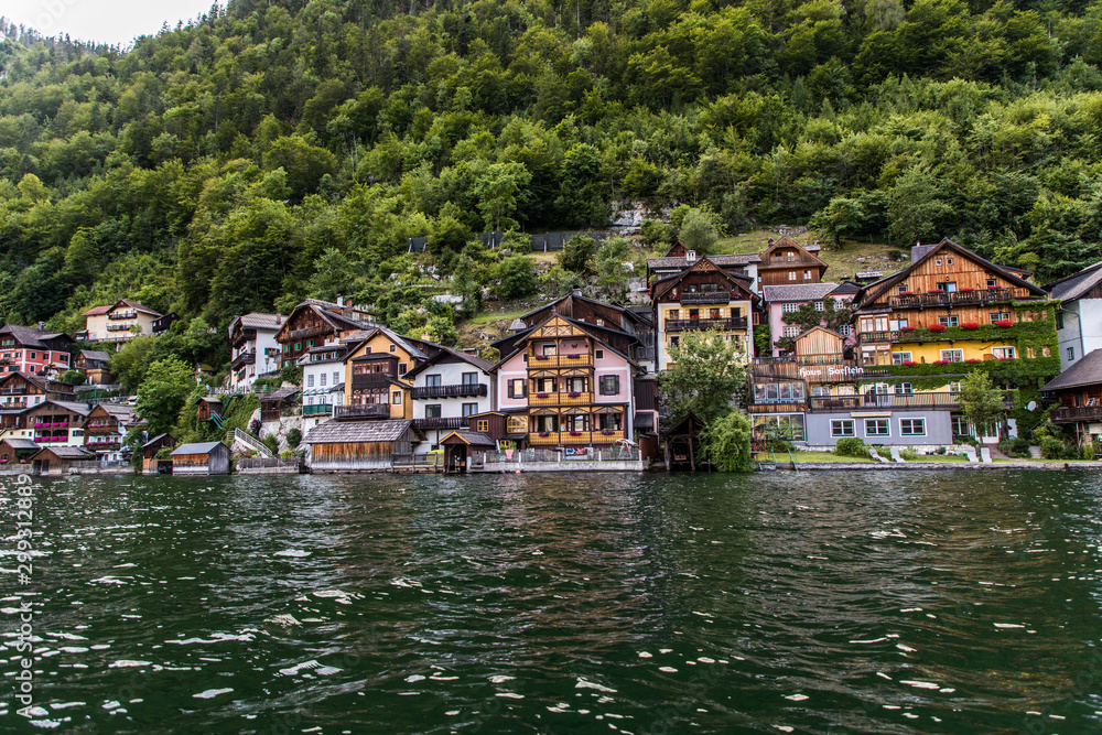 Hallstadt, Austria - July 2019: Picturesque old small town Hallstadt is Austrian state of Upper Austria, beautiful place surrounded by Alp mountains and amazing lake Dachstein