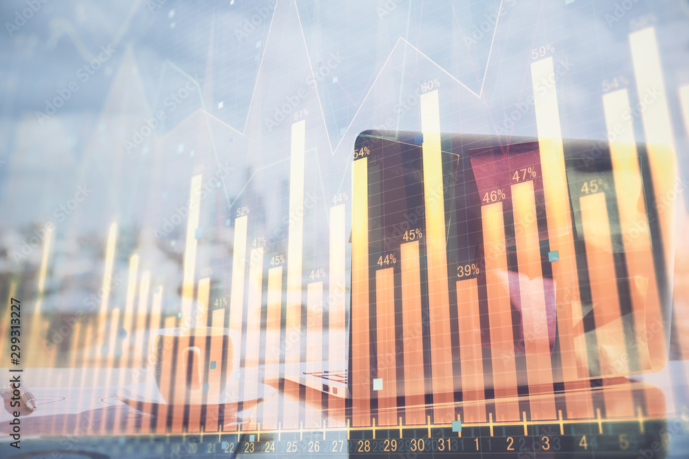 Stock market graph on background with desk and personal computer. Double exposure. Concept of financial analysis. Stock market graph on background with desk and personal computer. Double exposure. Concept of financial analysis.