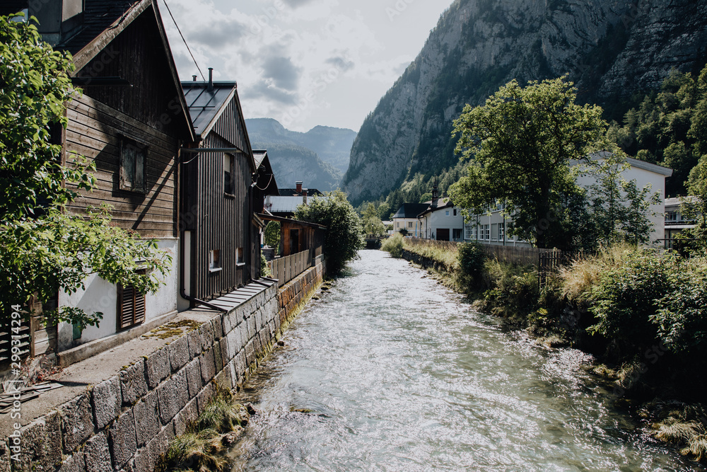 Hallstadt, Austria - July 2019: View of Hallstatt village and lake Hallstater See In Alps. Hallstadt, Austria - July 2019: View of Hallstatt village and lake Hallstater See In Alps.