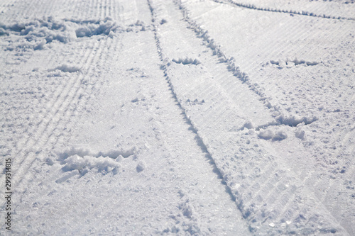 Straight tracks on snowy slope