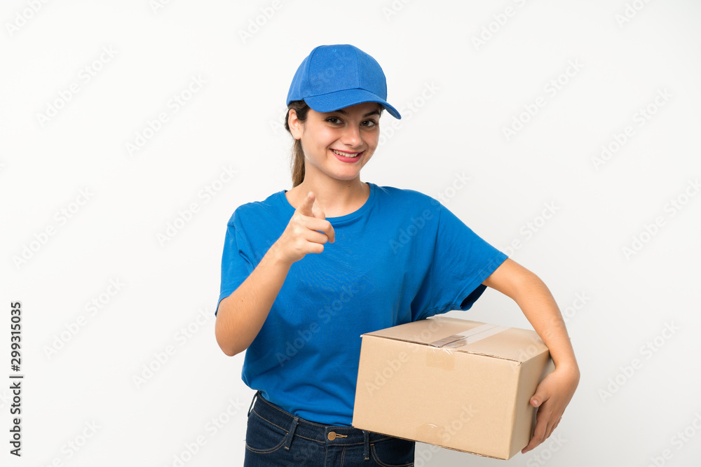 Young delivery girl over isolated white background points finger at you Young delivery girl over isolated white background points finger at you