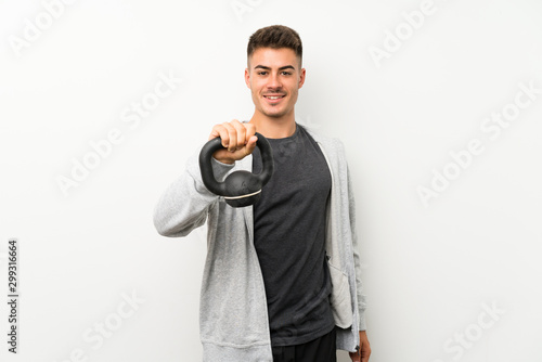 Sport man over isolated white wall with happy expression