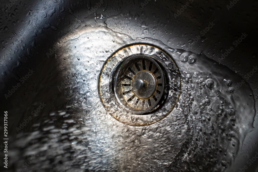 Water flowing and splashing in sink, Light and shadow, Close up & Macro shot, Selective focus, Healthcare concept Water flowing and splashing in sink, Light and shadow, Close up & Macro shot, Selective focus, Healthcare concept
