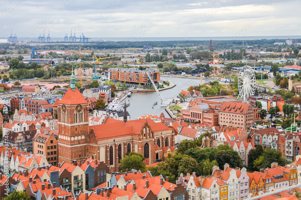Top view of the city of Poland Gdansk. Red roofs of houses, town hall and old square. Beautiful european city
