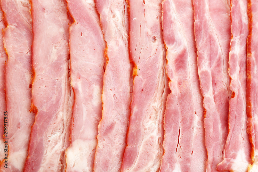 Slices of raw bacon as background, top view