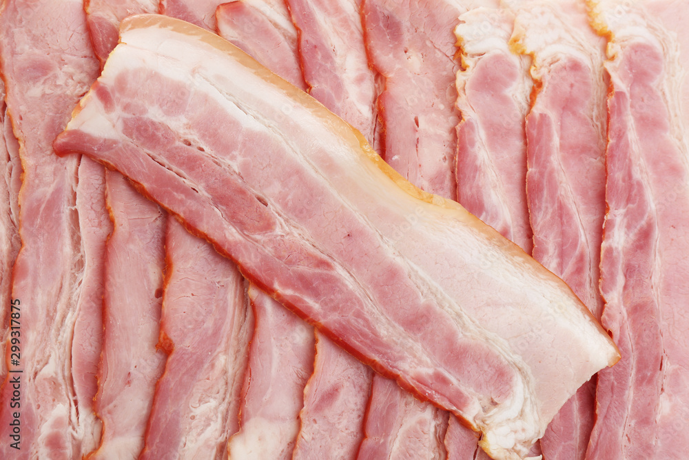 Slices of raw bacon as background, top view