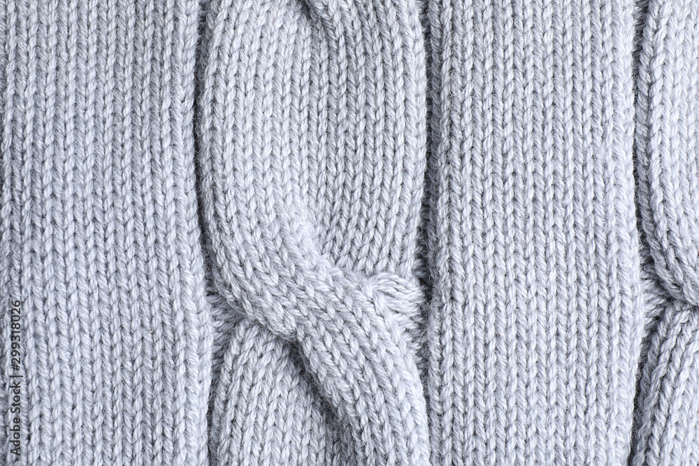 Warm knitted sweater as background, closeup view Warm knitted sweater as background, closeup view