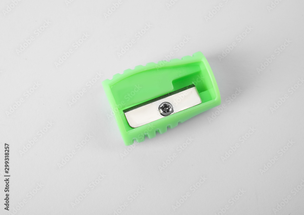 Modern green pencil sharpener on white background Modern green pencil sharpener on white background