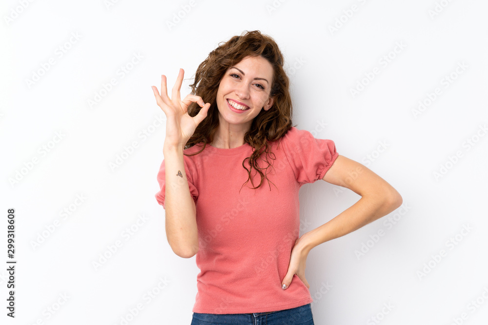 Young pretty woman over isolated background showing ok sign with fingers Young pretty woman over isolated background showing ok sign with fingers