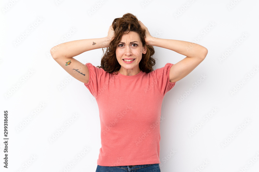 Young pretty woman over isolated background frustrated and takes hands on head Young pretty woman over isolated background frustrated and takes hands on head