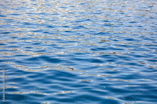 Blue expanse of water at sea as abstract background