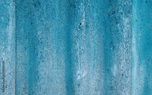 The wall is painted with blue paint as an abstract background