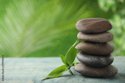 Composition with stones on table against blurred background. Zen concept