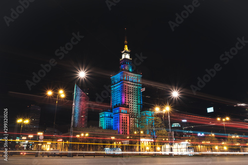 Warsaw at night, Poland. Long exposure photo of Palace of Culture and Science and downtown business skyscrapers, city center.