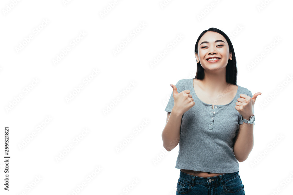 happy attractive asian girl showing thumbs up isolated on white
