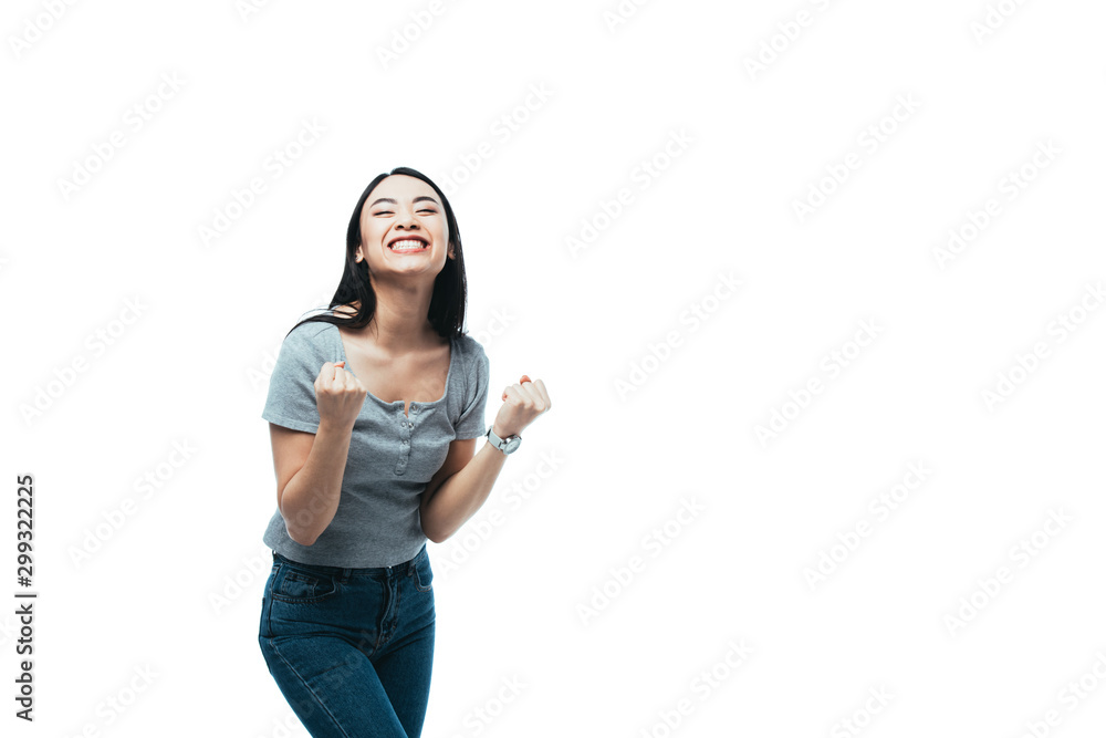 happy asian girl showing yeah gesture isolated on white happy asian girl showing yeah gesture isolated on white