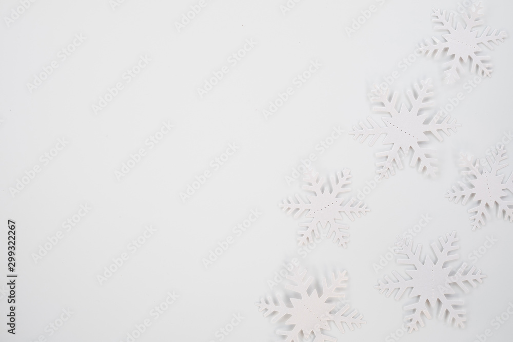 Christmas composition. Christmas frame made of snowflakes on white background. Winter concept. Flat lay, top view, copy space .