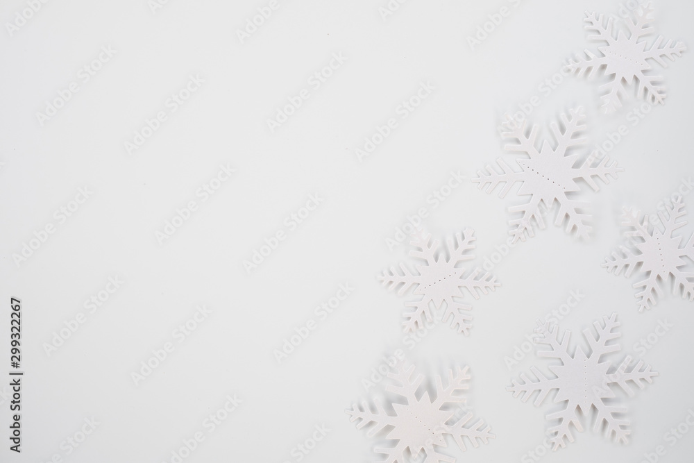 Christmas composition. Christmas frame made of snowflakes on white background. Winter concept. Flat lay, top view, copy space . Christmas composition. Christmas frame made of snowflakes on white background. Winter concept. Flat lay, top view, copy space .