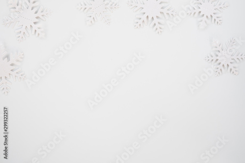 Christmas composition. Christmas frame made of snowflakes on white background. Winter concept. Flat lay  top view  copy space .