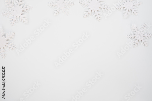 Christmas composition. Christmas frame made of snowflakes on white background. Winter concept. Flat lay, top view, copy space .