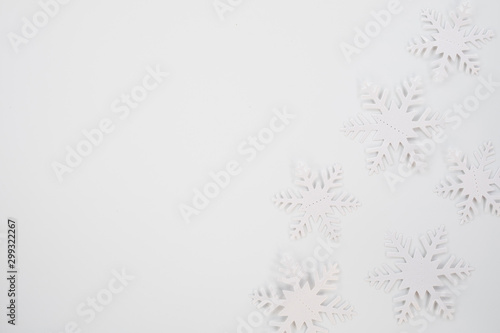 Christmas composition. Christmas frame made of snowflakes on white background. Winter concept. Flat lay, top view, copy space .