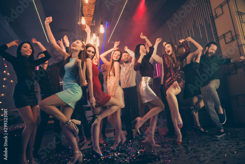 Lets party hard. Low angle view full body photo of positive cheerful youth people want celebrate high-school graduation event weekend feel crazy wild wear formalwear skirt high-heels in nightclub