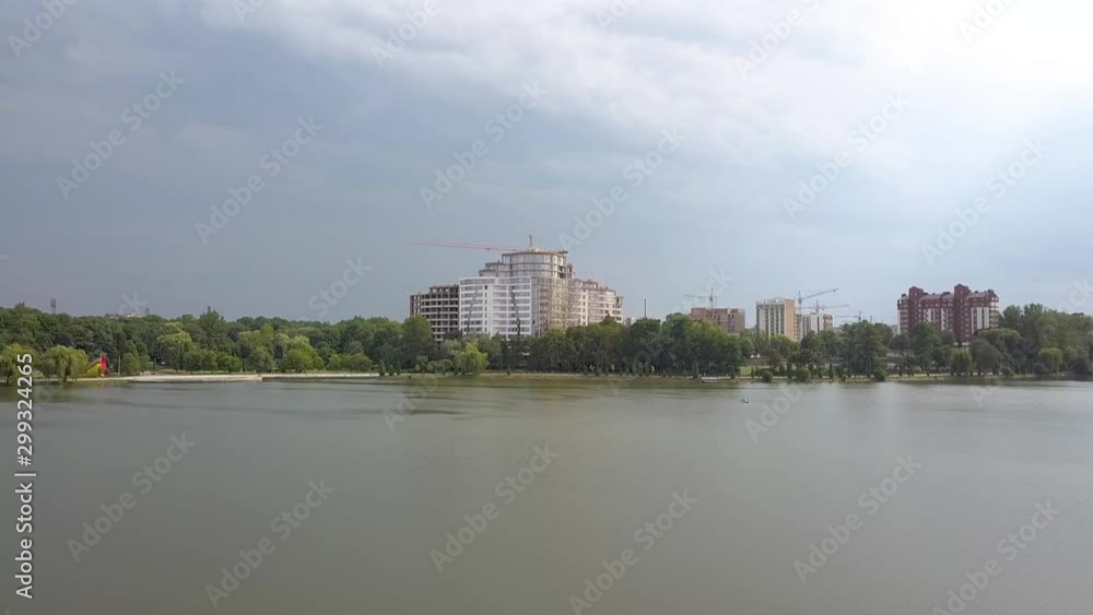 Aerial view of Ivano-Frankivsk city, Ukraine. Urban landscape wath tall buildings reflected in town lake water. Aerial view of Ivano-Frankivsk city, Ukraine. Urban landscape wath tall buildings reflected in town lake water.