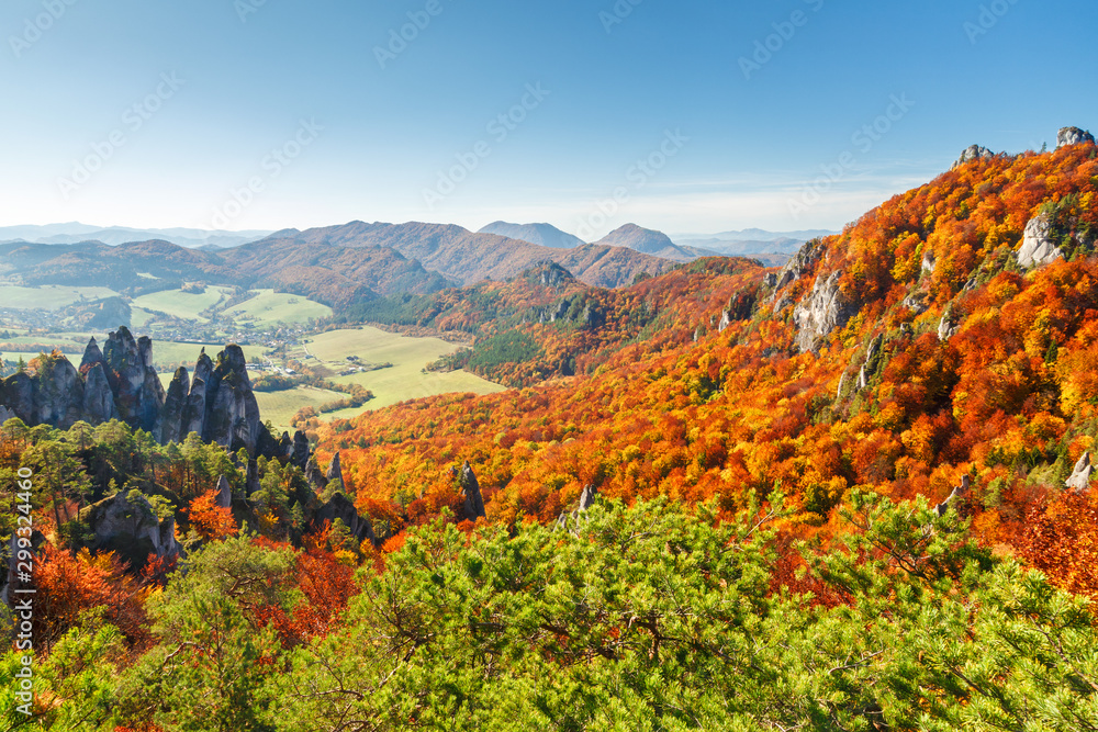Brightly colored forests of mountains at autumn. National Nature Reserve Sulov Rocks, Slovakia, Europe.